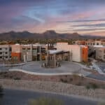 aerial photo of large real estate investment community taken at sunset