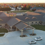 Aerial image of real estate investment community in Bloomington Illinois with bright sunset